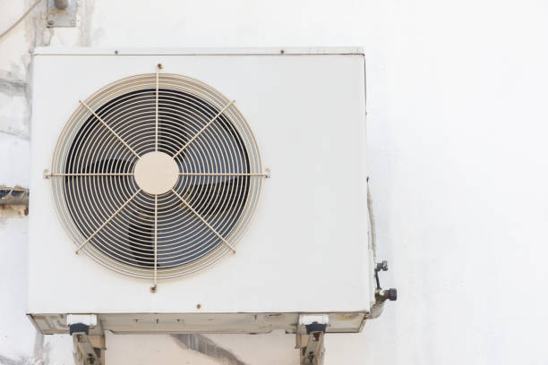 HVAC technician servicing ductless mini split system