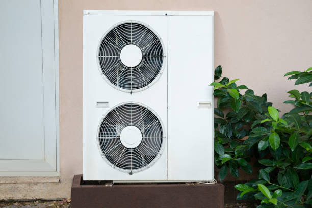Certified HVAC technician installing ductless mini split